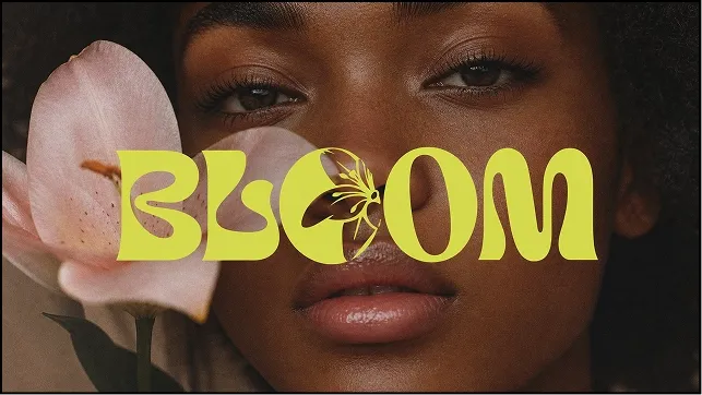 Typography poster: a close-up portrait beside a pale pink lily, with the word BLOOM in bold lime-yellow letters